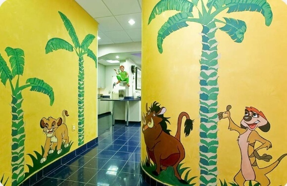 Disney mural on dental office hallway walls