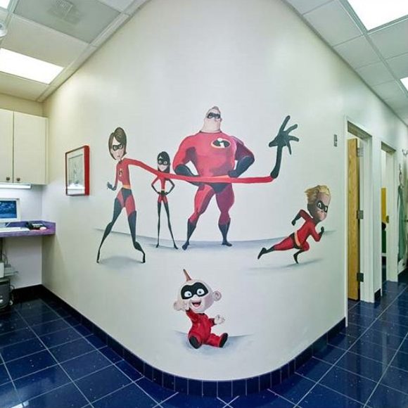 The Incredibles family mural on dental office hallway wall