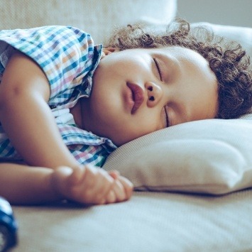 Toddler sleeping after sedation dentisrtry treatment