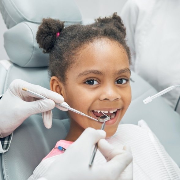 Child receiving dental treatment