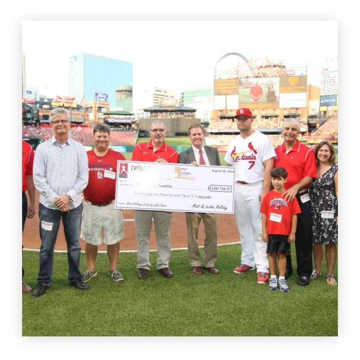 Doctor Sedighi presenting donation to Pujols Family Foundation