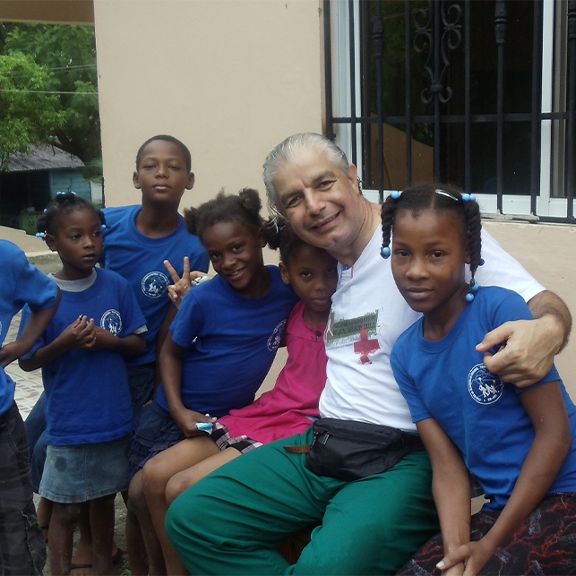 Dentist and group of children on mission trip