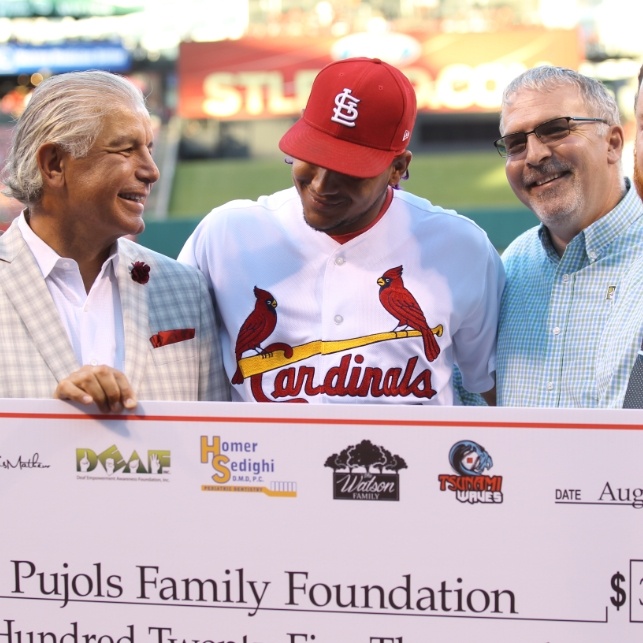 Cardinal player receiving donation for Pujols Family Foundation