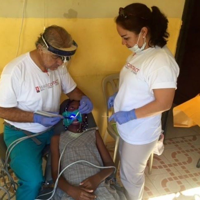 Dentist treating patient during a mission trip