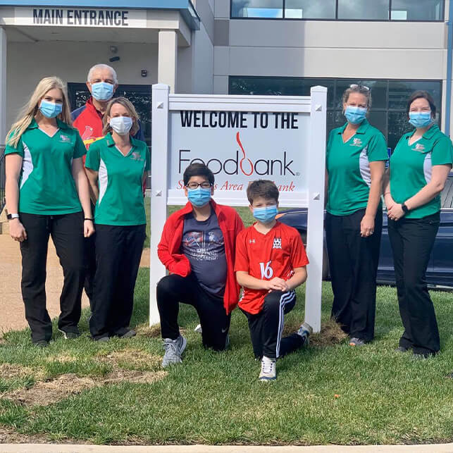 Dentist and dental team volunteering at the food bank