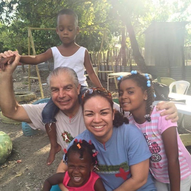 Dentist team member and young patients on mission trip