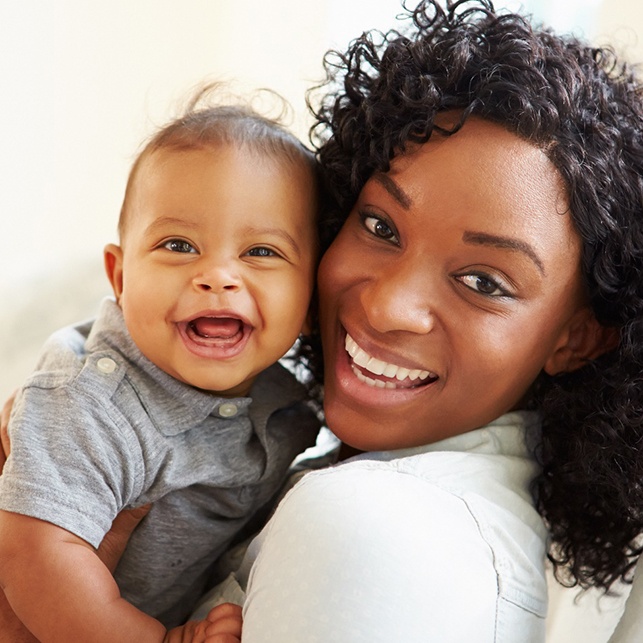 Mother and baby smiling after frenectomy in Chesterfield