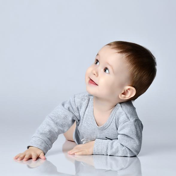 Happy, crawling baby, ready for dentistry for infants in Chesterfield