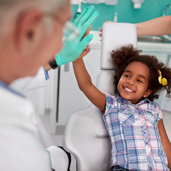 child high-fiving dentist in Chesterfield