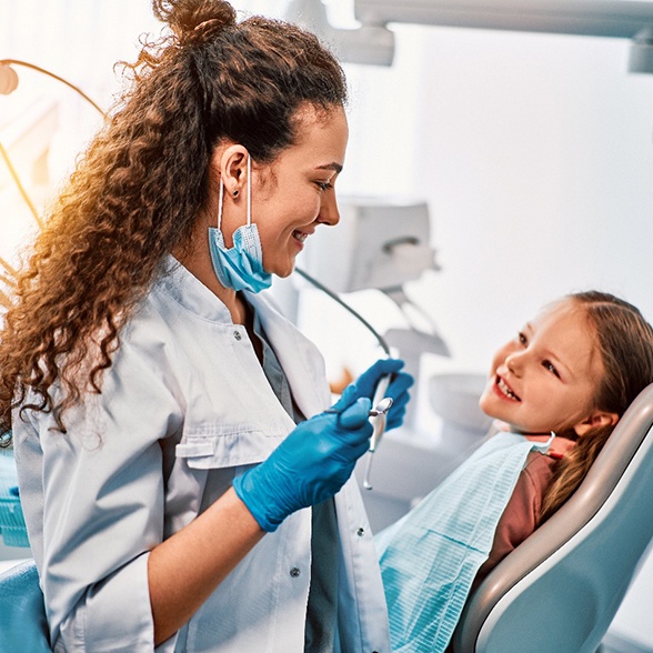 a pediatric dentist about to examine a child’s mouth