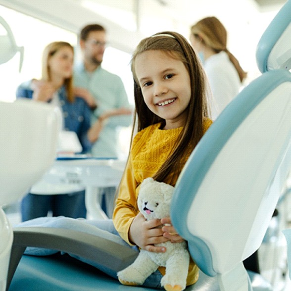 young girl smiling while visiting dentist in Chesterfield