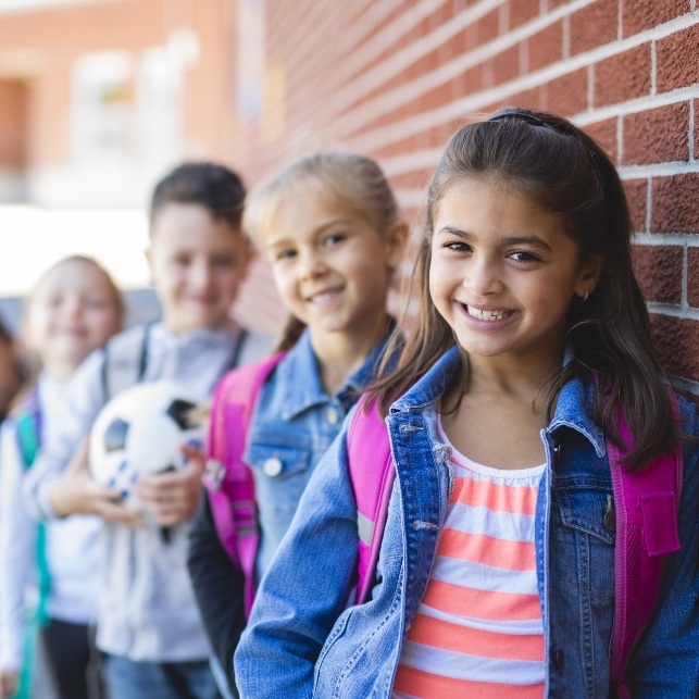 Group of children sharing healthy smiles thanks to preventive dentistry