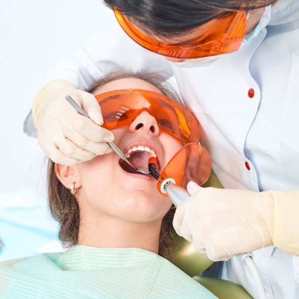 Patient receiving dental sealants