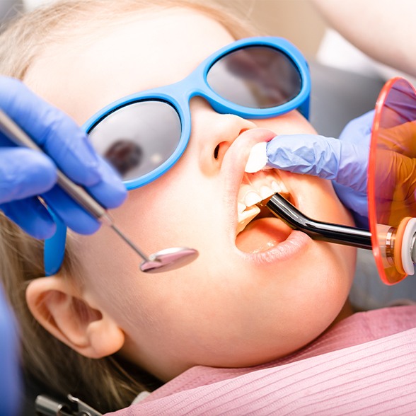 Patient receiving dental bonding treatment