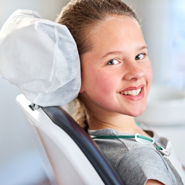 Young girl smiling during sedation dentistry visit