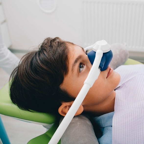 Young patient with nitrous oxide dental sedation mask in place