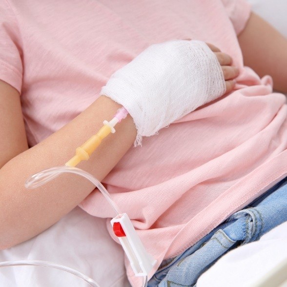 A closeup of a child receiving an IV