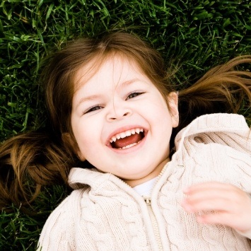 Little girl laughing after special needs dentistry visit