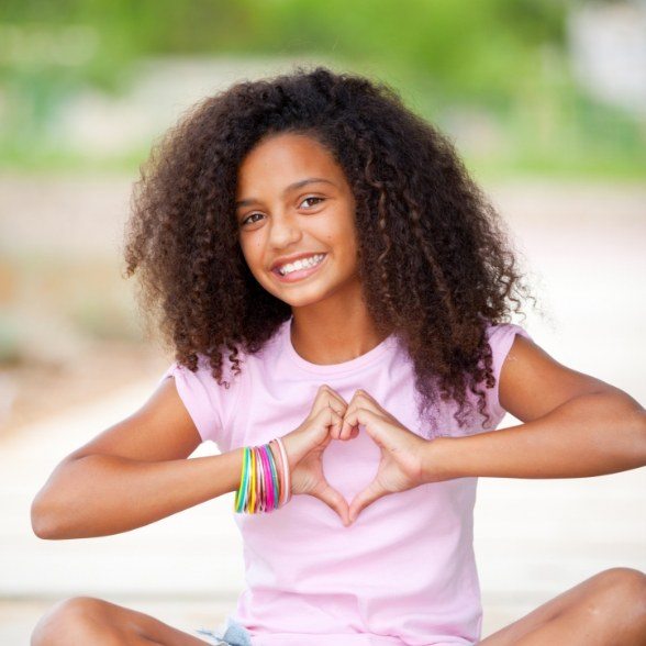 Smiling young girl after dentistry for children