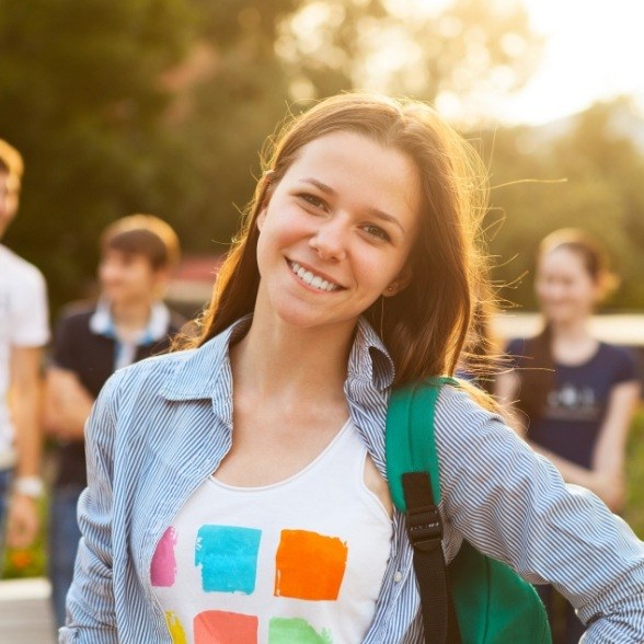 Smiling young woman after dentistry for teens