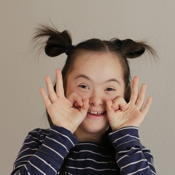 Young woman smiling after dentistry for special needs