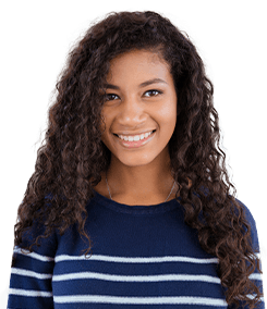Teen girl with curly hair smiling