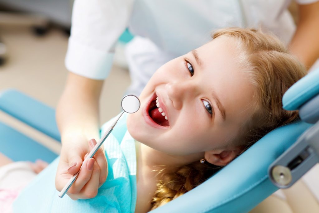 Closeup of child smiling during dental checkup