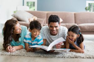 Mother and child reading book together