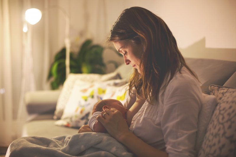 Mother breastfeeding newborn