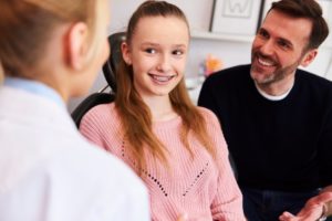 Teen smiling at dentist appointment