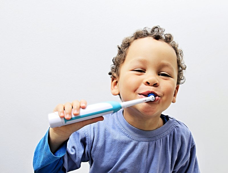 child brushing their teeth